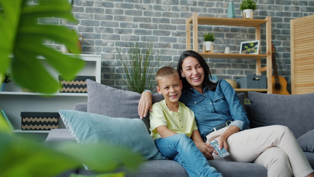 Parent and child using connected entertainment at home, representing Wi-Fi inside the home