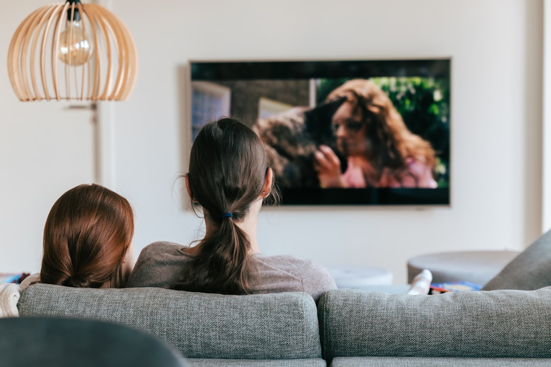 Family watching together at home, representing everyday residential internet and streaming