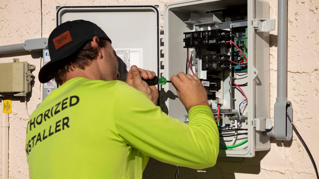 Technician working on network infrastructure, representing NBN connection technologies in Australia